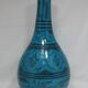 Islamic ceramic vase with turquoise background