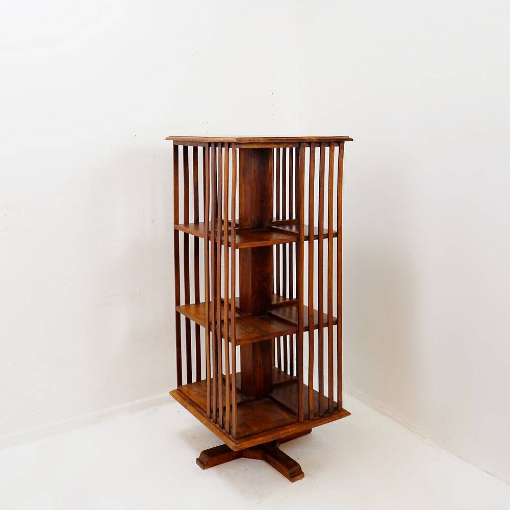 Rotating library on three levels with a central cruciform base.