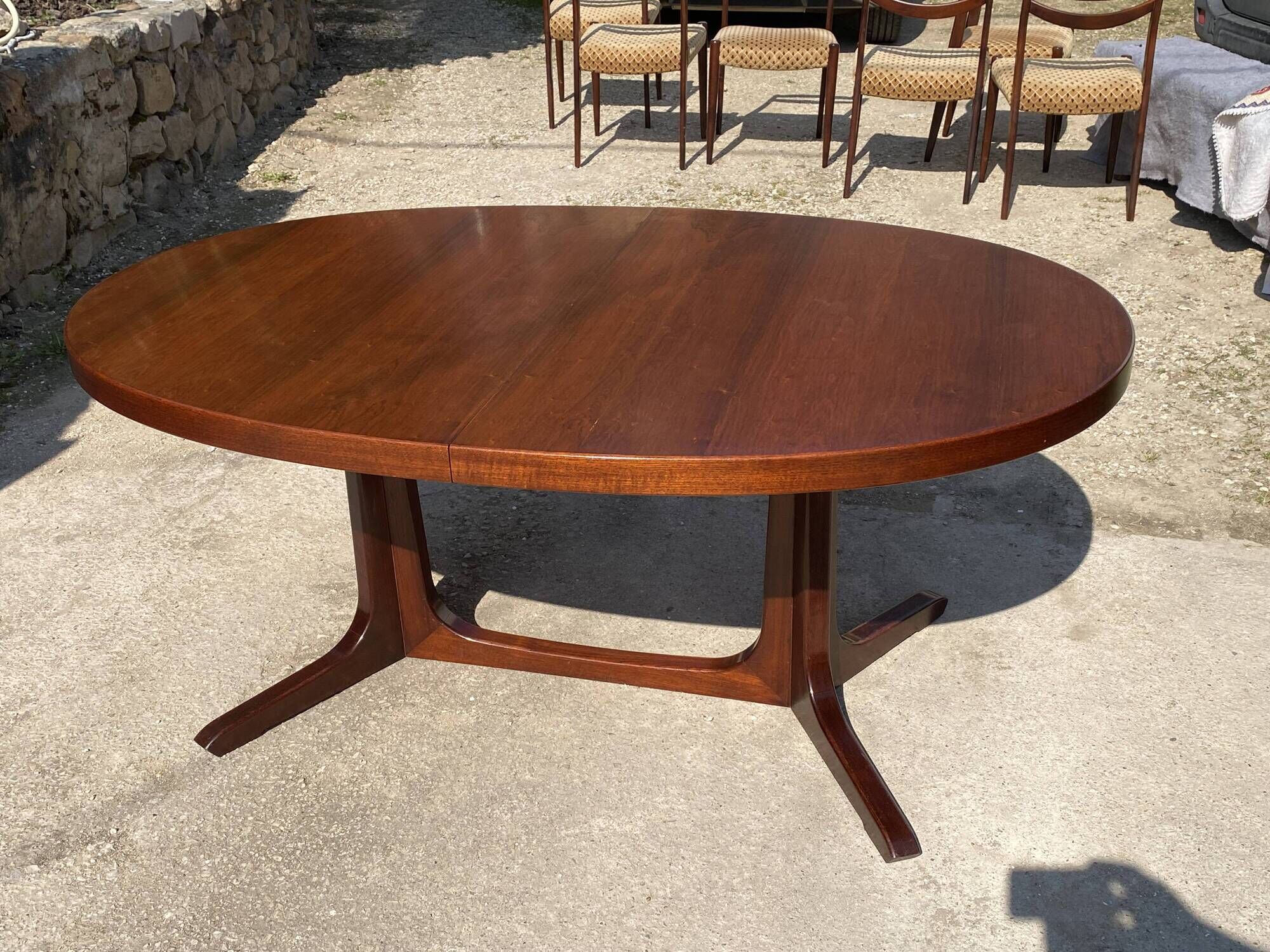 Baumann round oval extendable Scandinavian table in rosewood with 2 extensions.