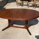 Baumann round oval extendable Scandinavian table in rosewood with 2 extensions.
