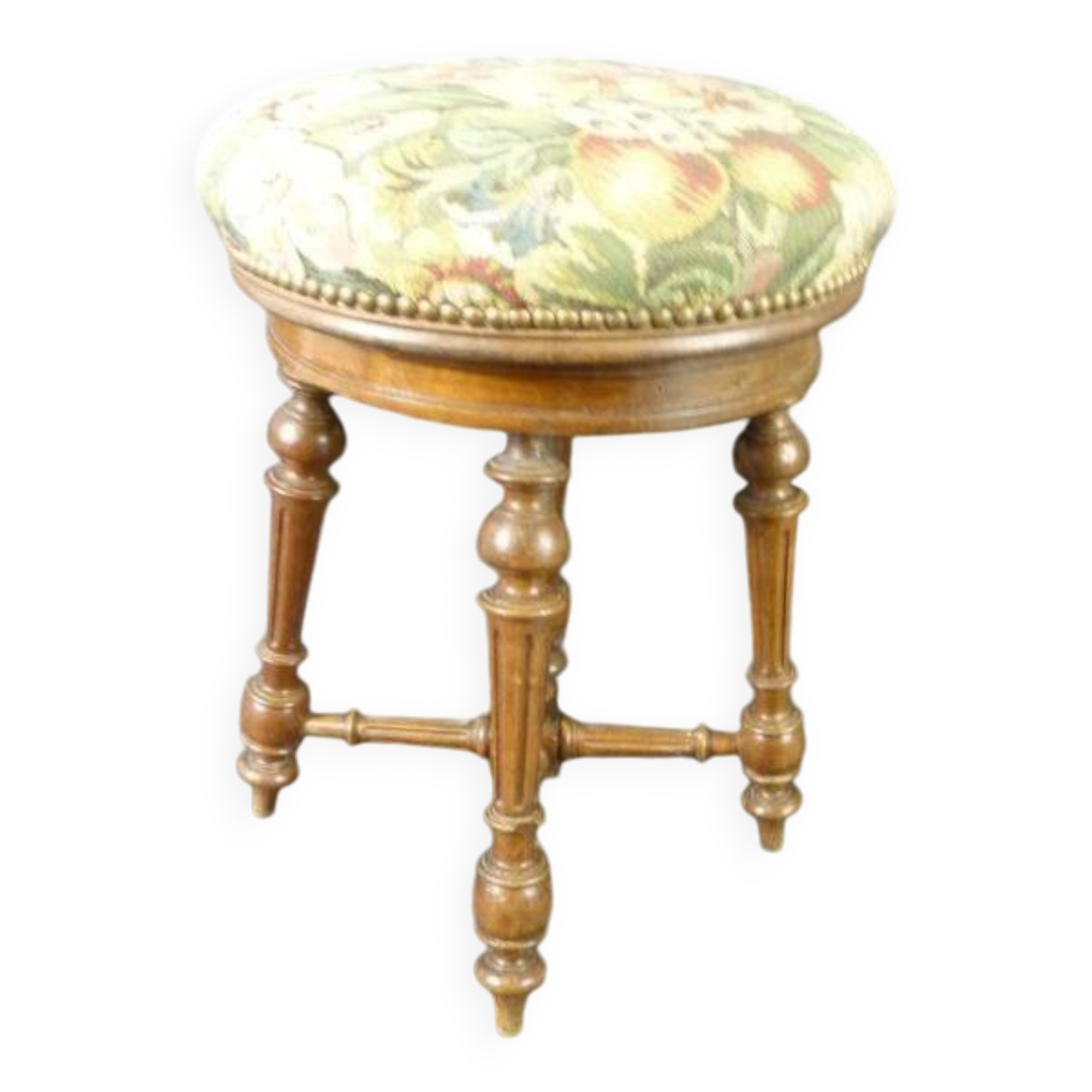 Old upholstered piano stool