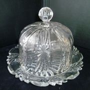 Old cheese bell on its molded pressed glass tray