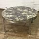 Round vintage coffee table with marble top and chrome base