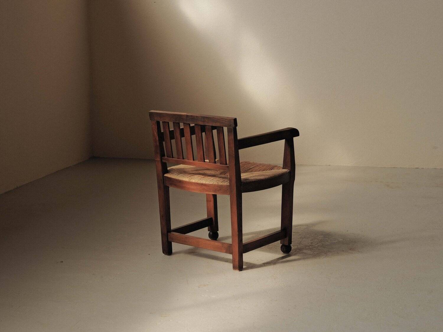 Handcrafted oak and straw armchair, France, circa 1950.