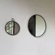 Brutalist round mirror with wrought iron and studs.