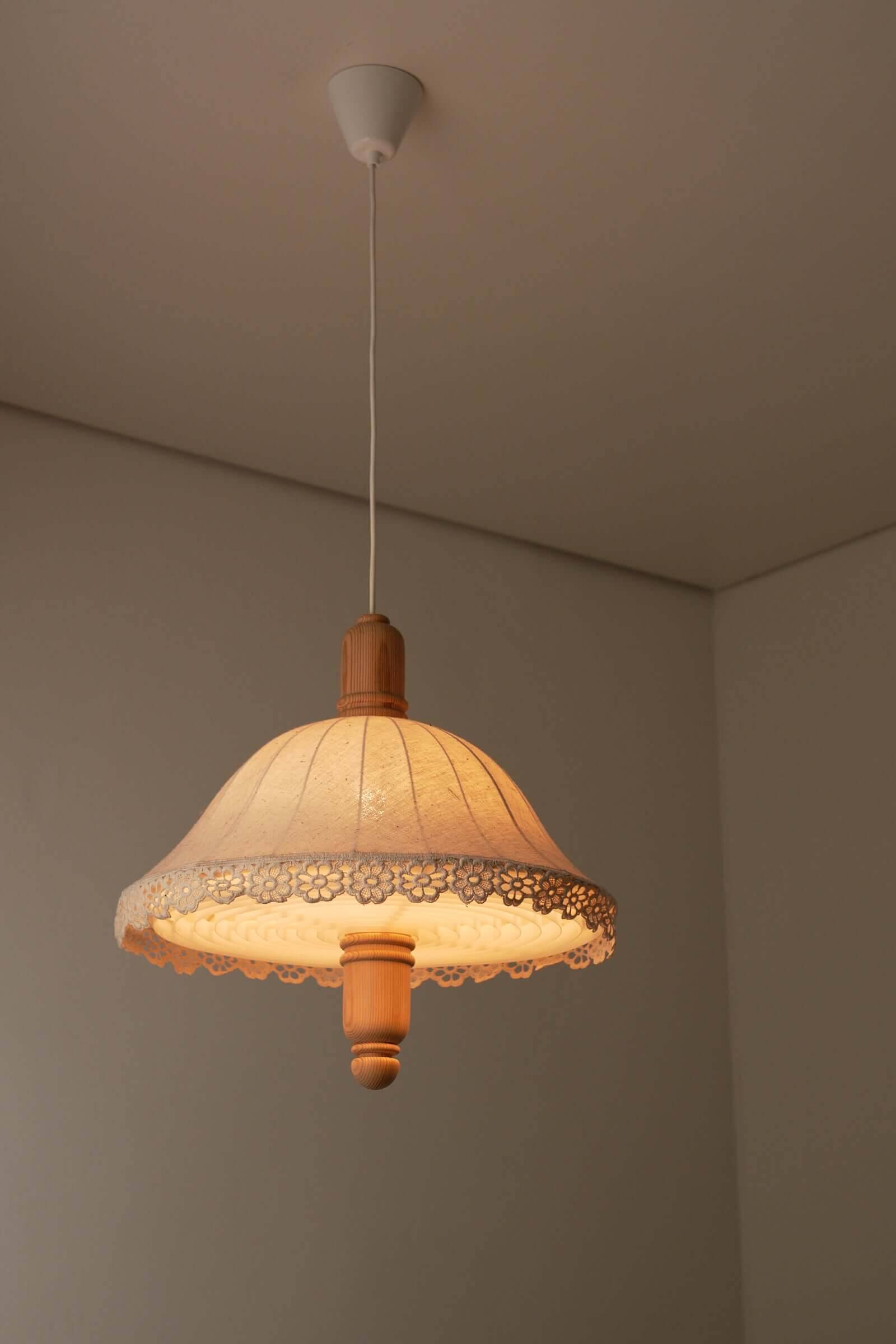 Wood and textile pendant from Sweden