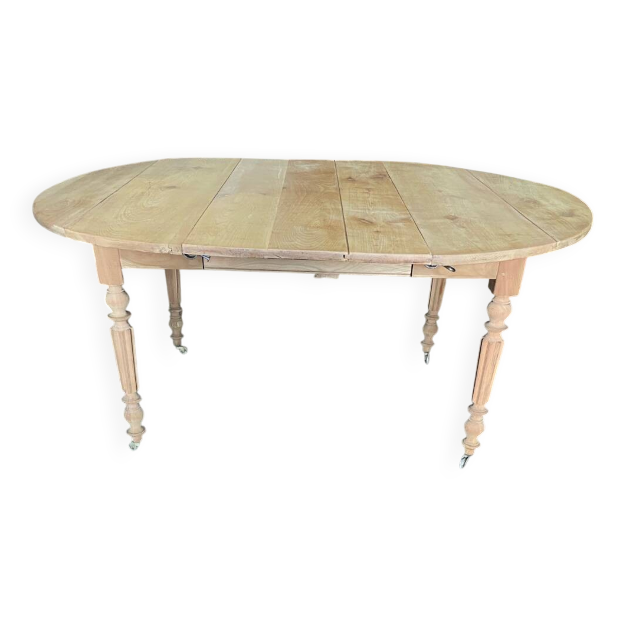 Oval wooden table on wheels.
