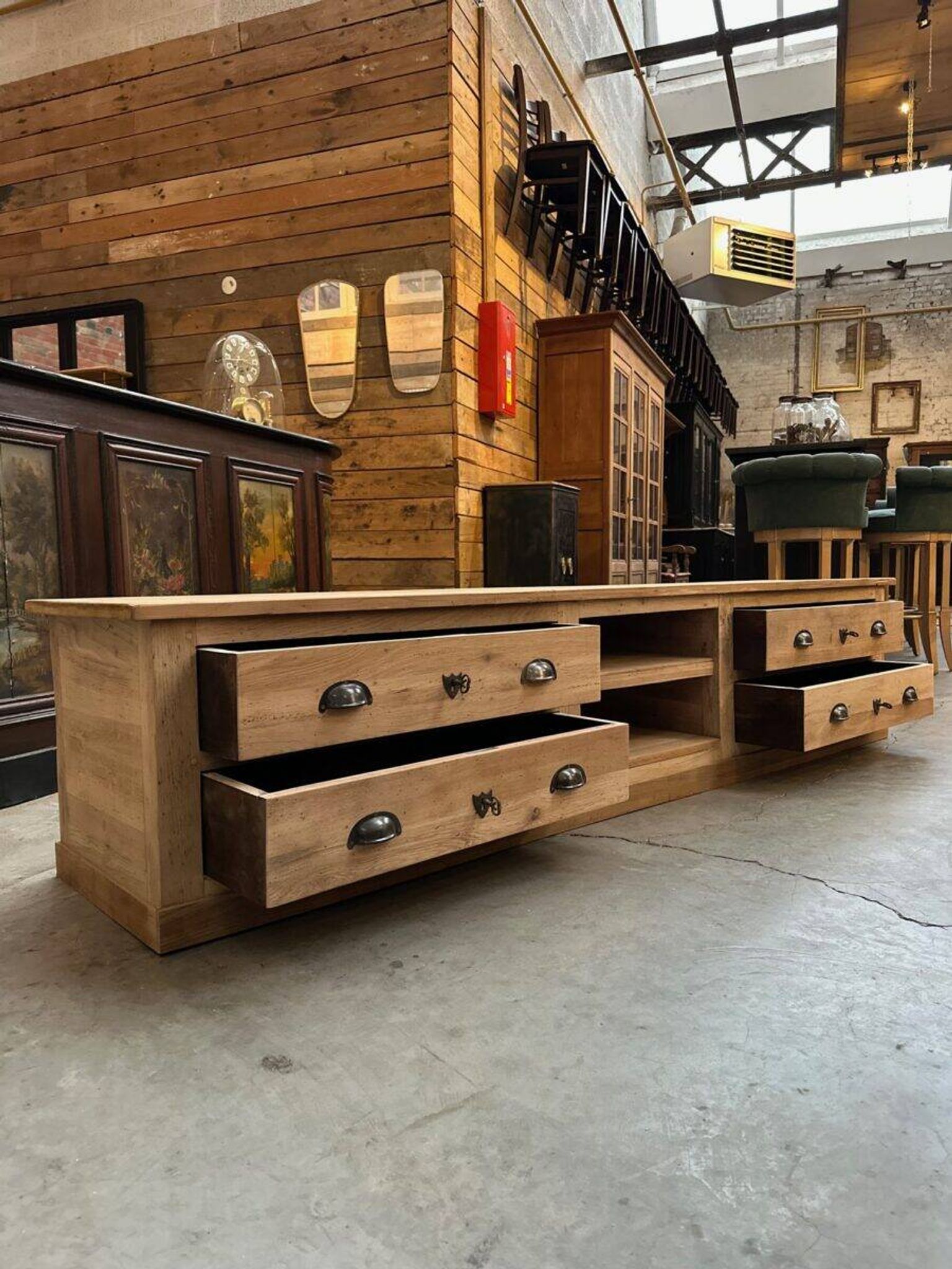 An old piece of workshop furniture transformed into a TV stand