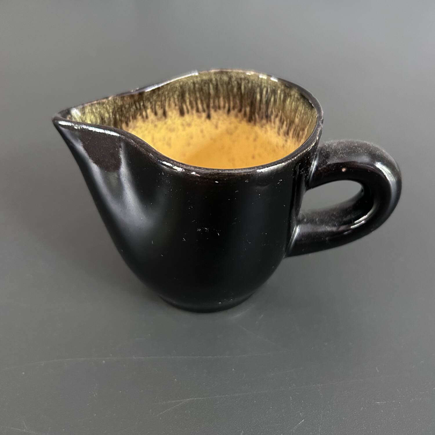 Keraluc black and yellow creamer