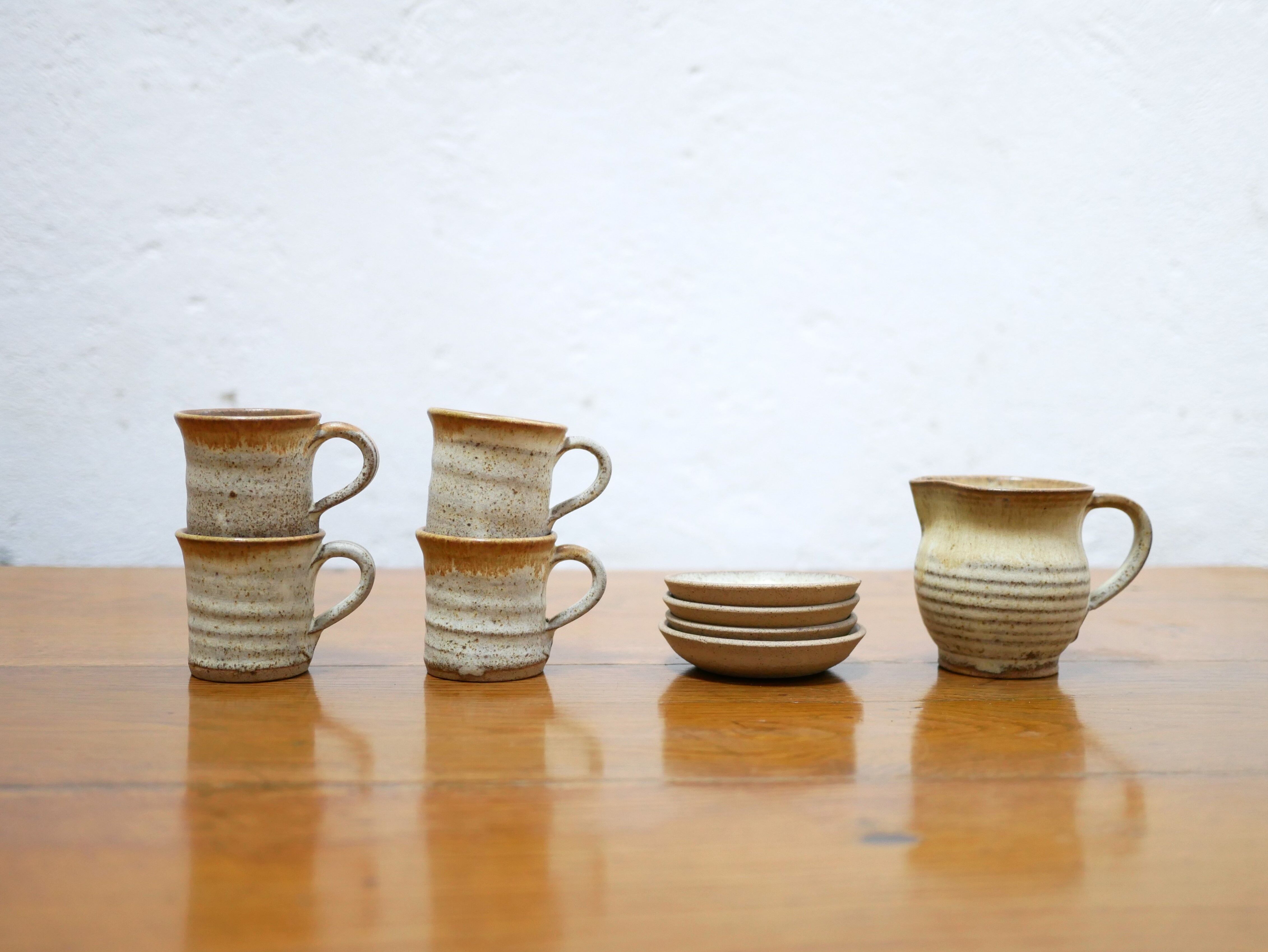 Series of 4 cups and a vintage stoneware milk jug