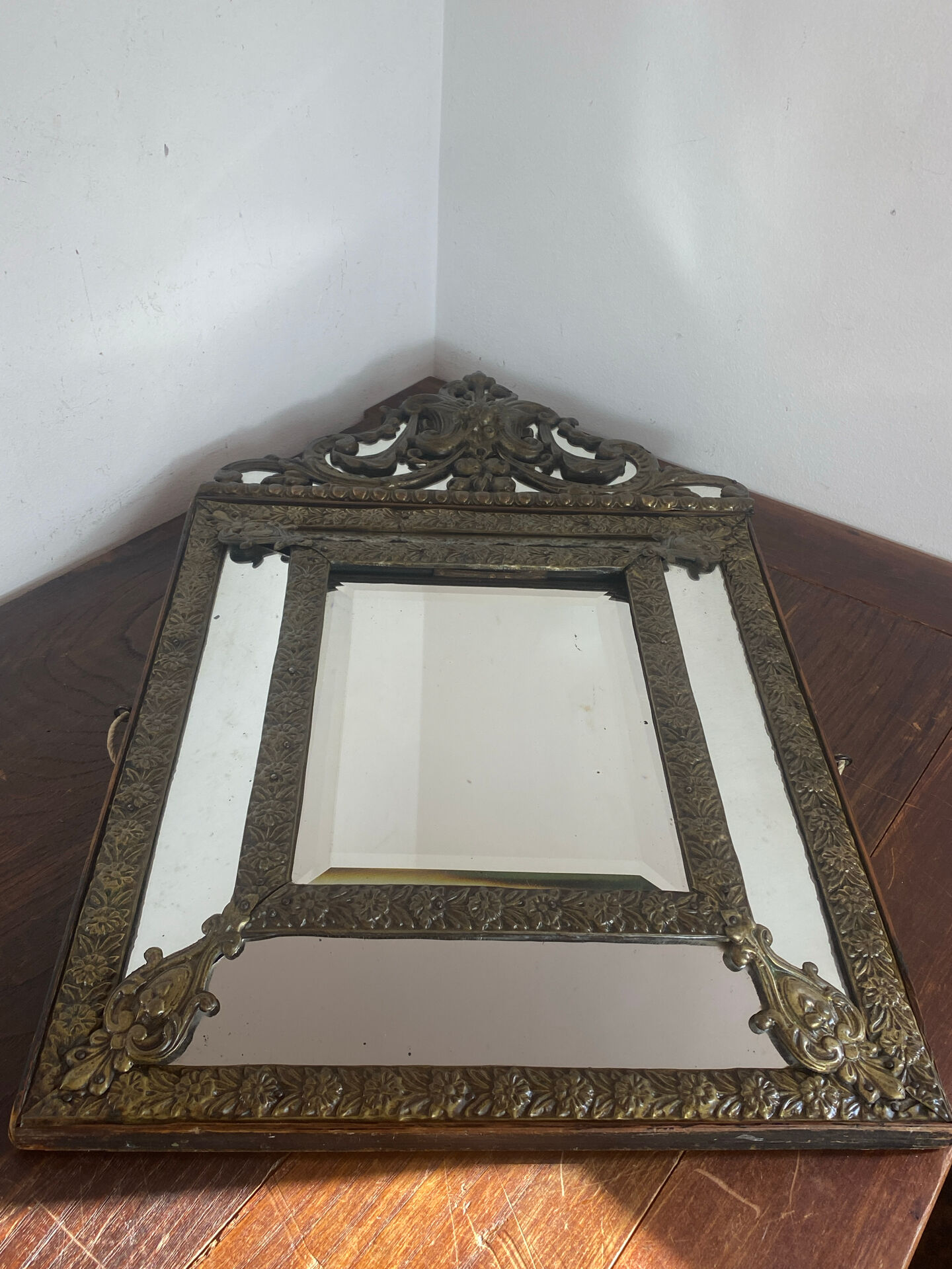 Mirror with brass repoussé frame