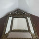 Mirror with brass repoussé frame