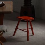 Pair of patinated wooden stools painted red with flared legs, 1950s-1960s.