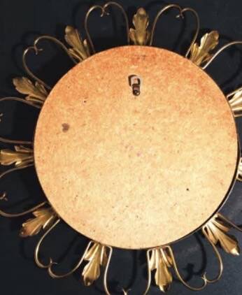 50s “witch’s eye” sun mirror. deknudt hollywood regency