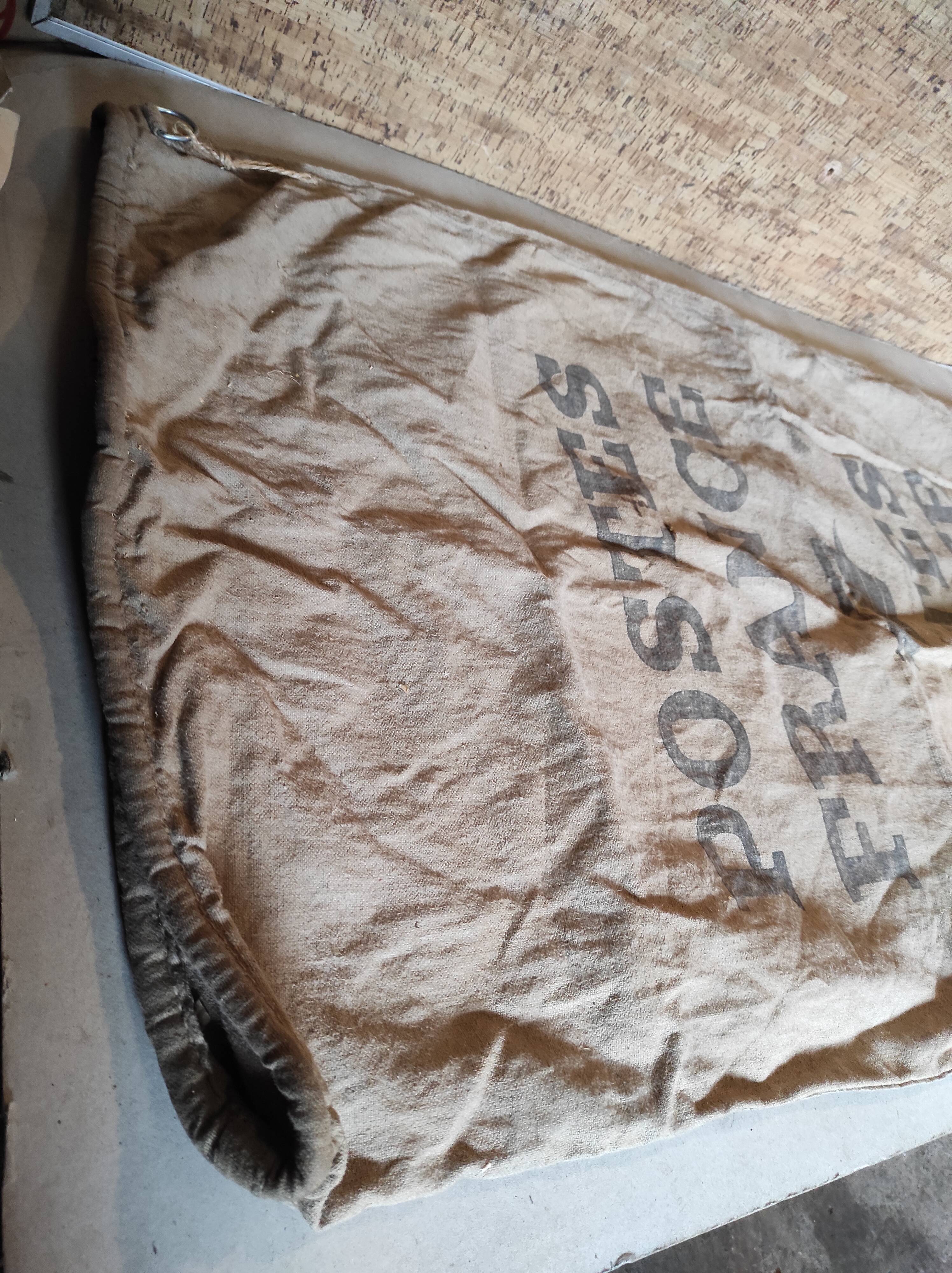 Vintage postal bag trade object of La Poste in mixed-race canvas burlap