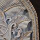Bas-relief sculpture, stylized face with flowers, 20th century