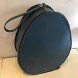 Suitcase has an air hostess hat