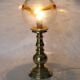 Table lamp in solid brass with a vintage 1970s glass globe.