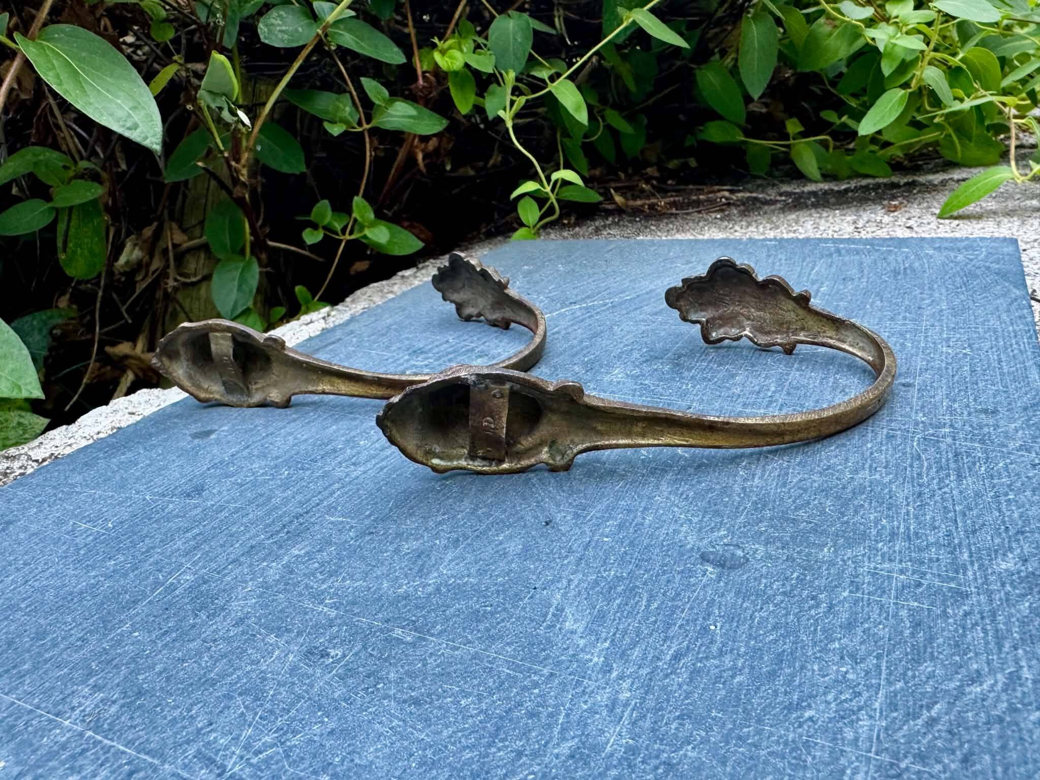 Pair of bronze putti coat hooks signed Art Nouveau period