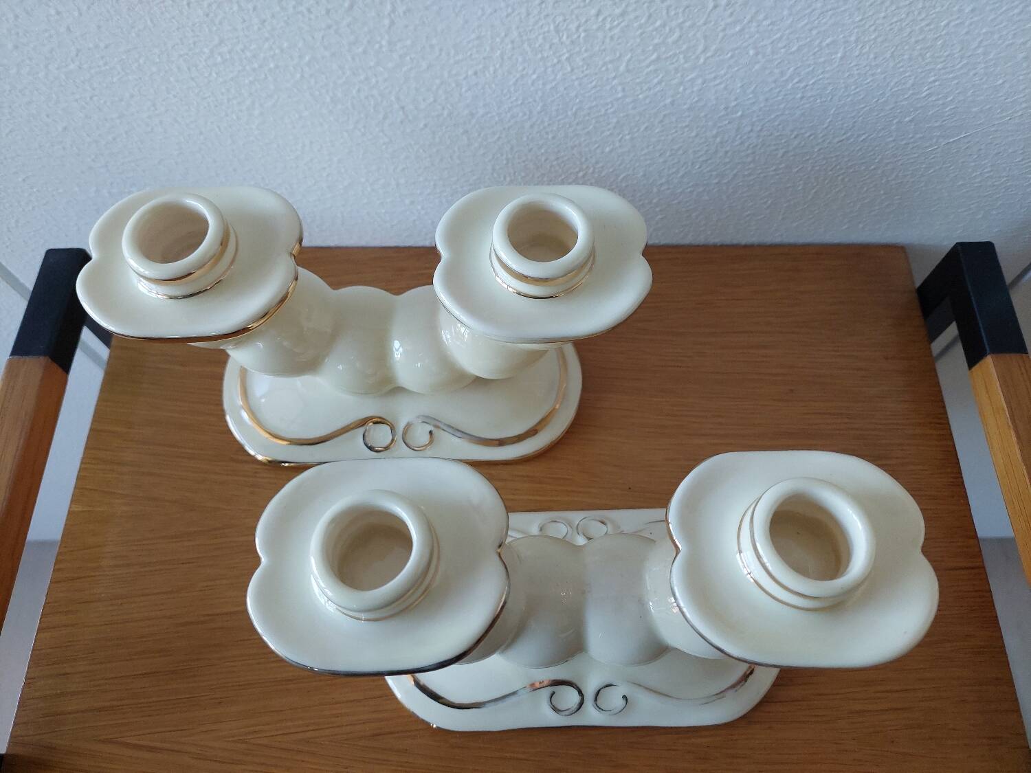 Pair of cream ceramic candlesticks with gold trim circa 1930-1950