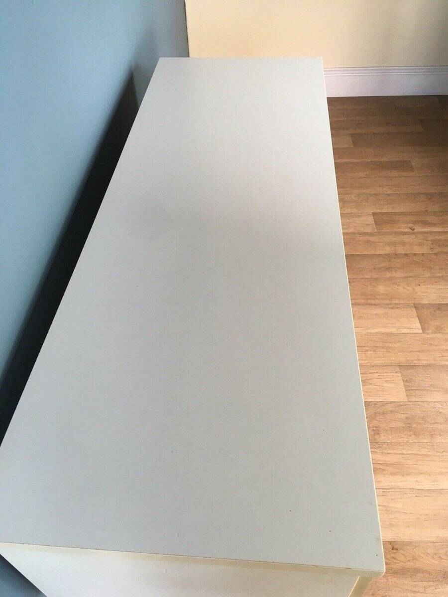 White retro wooden commode in Mid-Century style, tapered legs and gold handles (1960s)