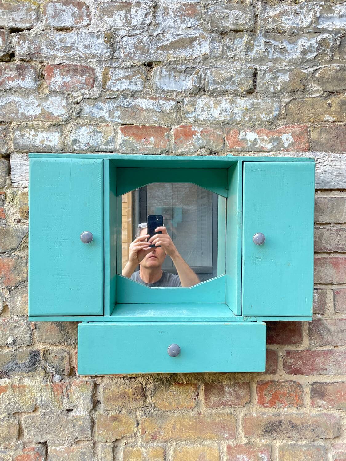 Old wall-mounted bathroom cabinet