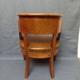 Fauteuil de bureau garni de cuir début XIXe siècle,
