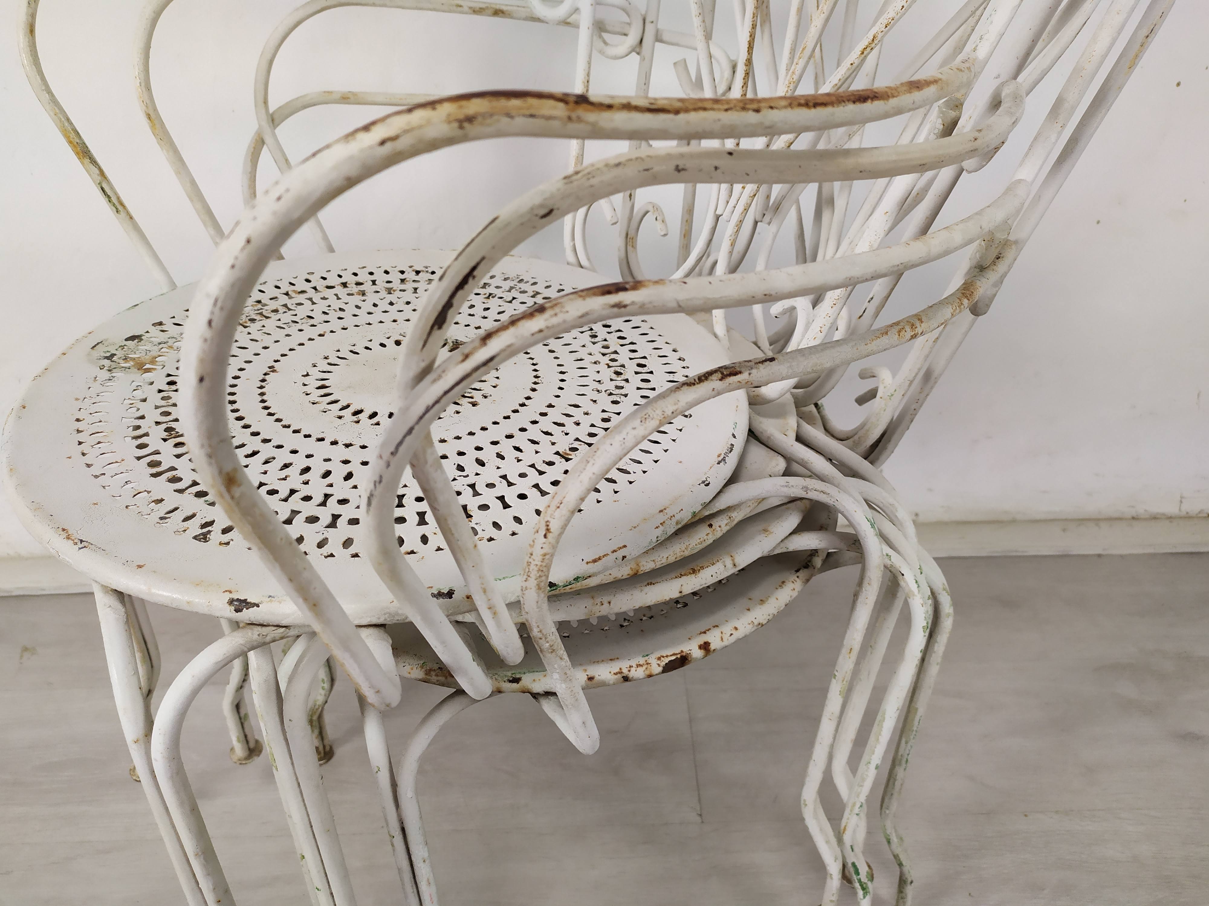 4 wrought iron garden armchairs