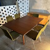 Extendable teak and teak veneer dining table