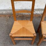 2 solid wood and straw chairs