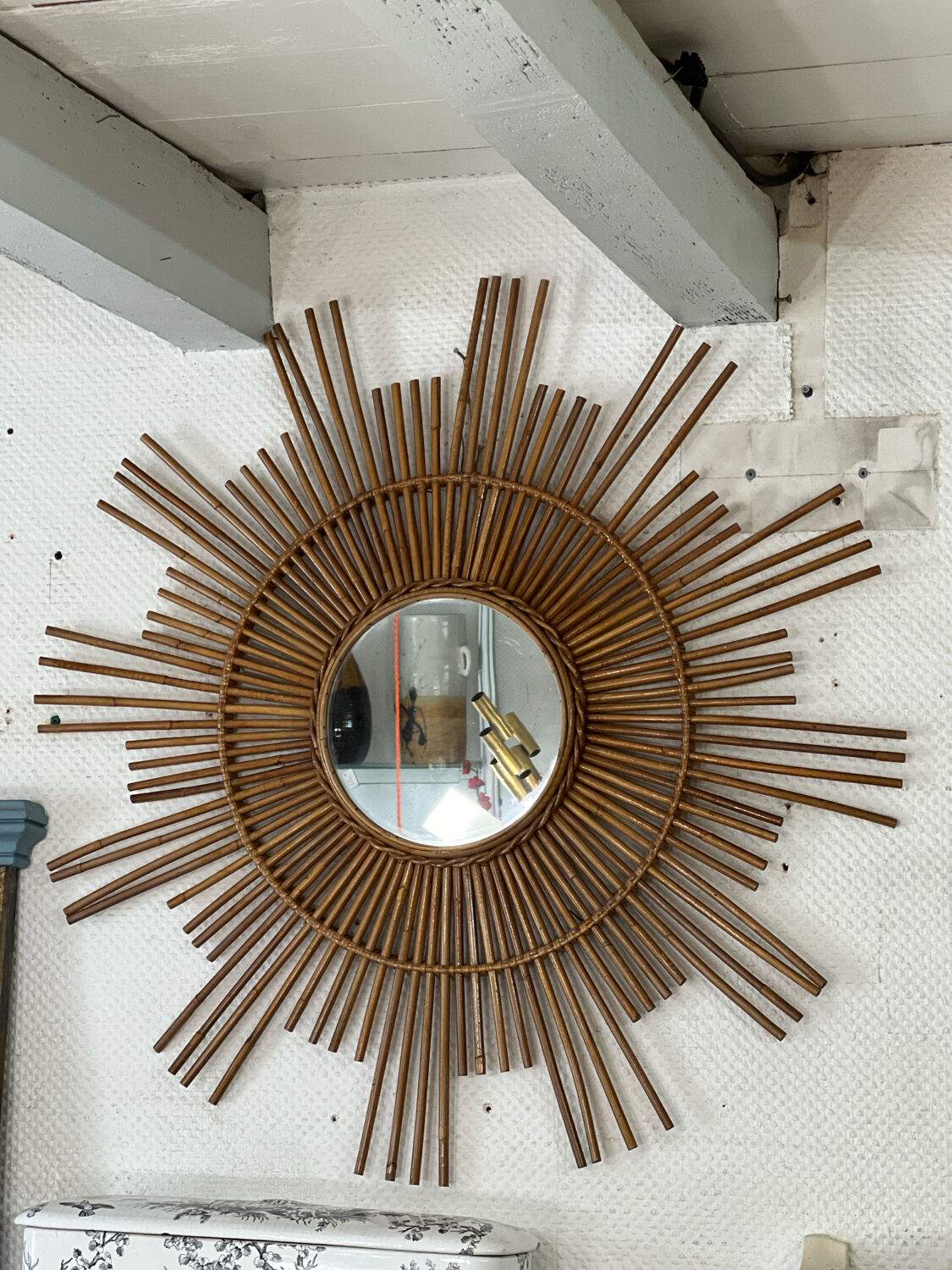 Large sun mirror in rattan