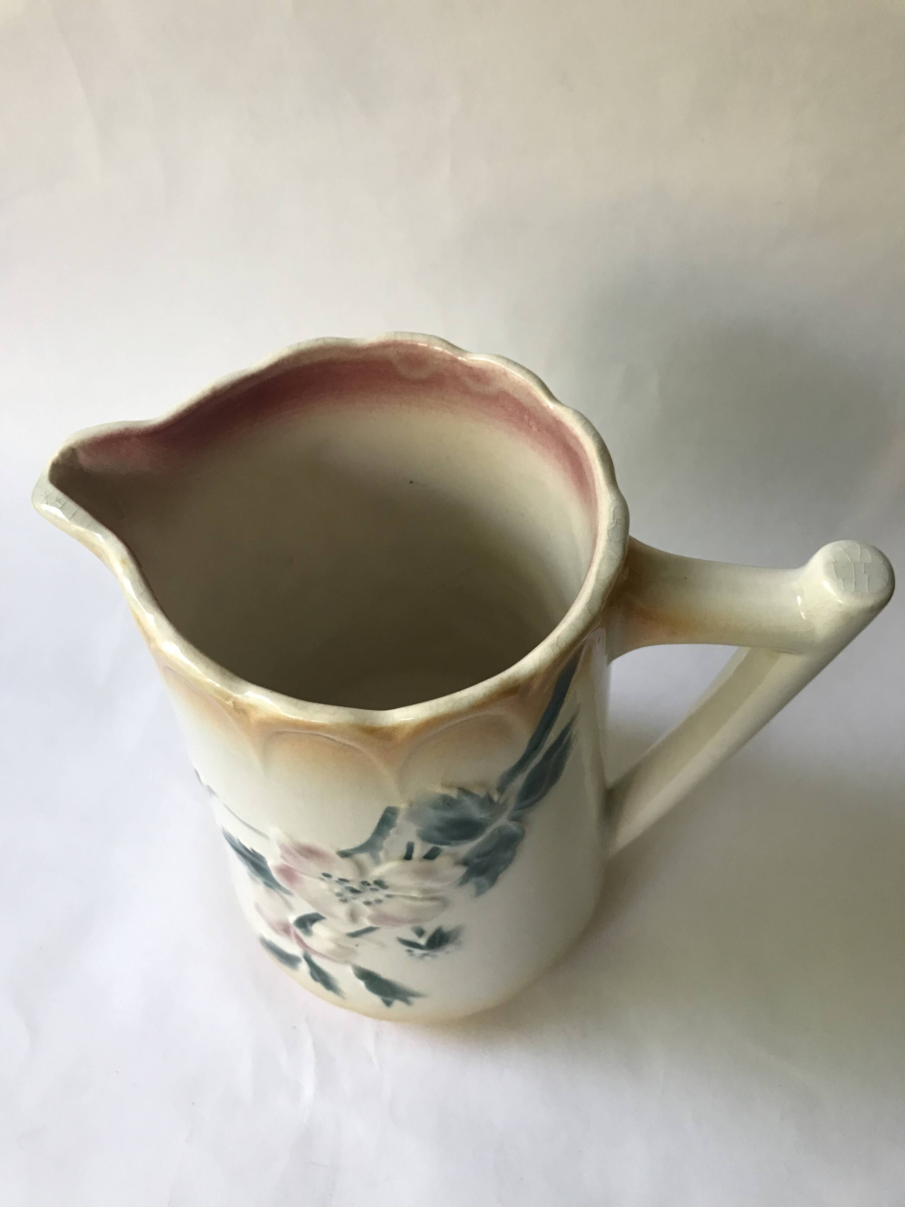 Antique barbotine pitcher with floral decoration numbered 548