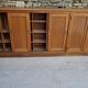 Oak workshop furniture with sliding doors.