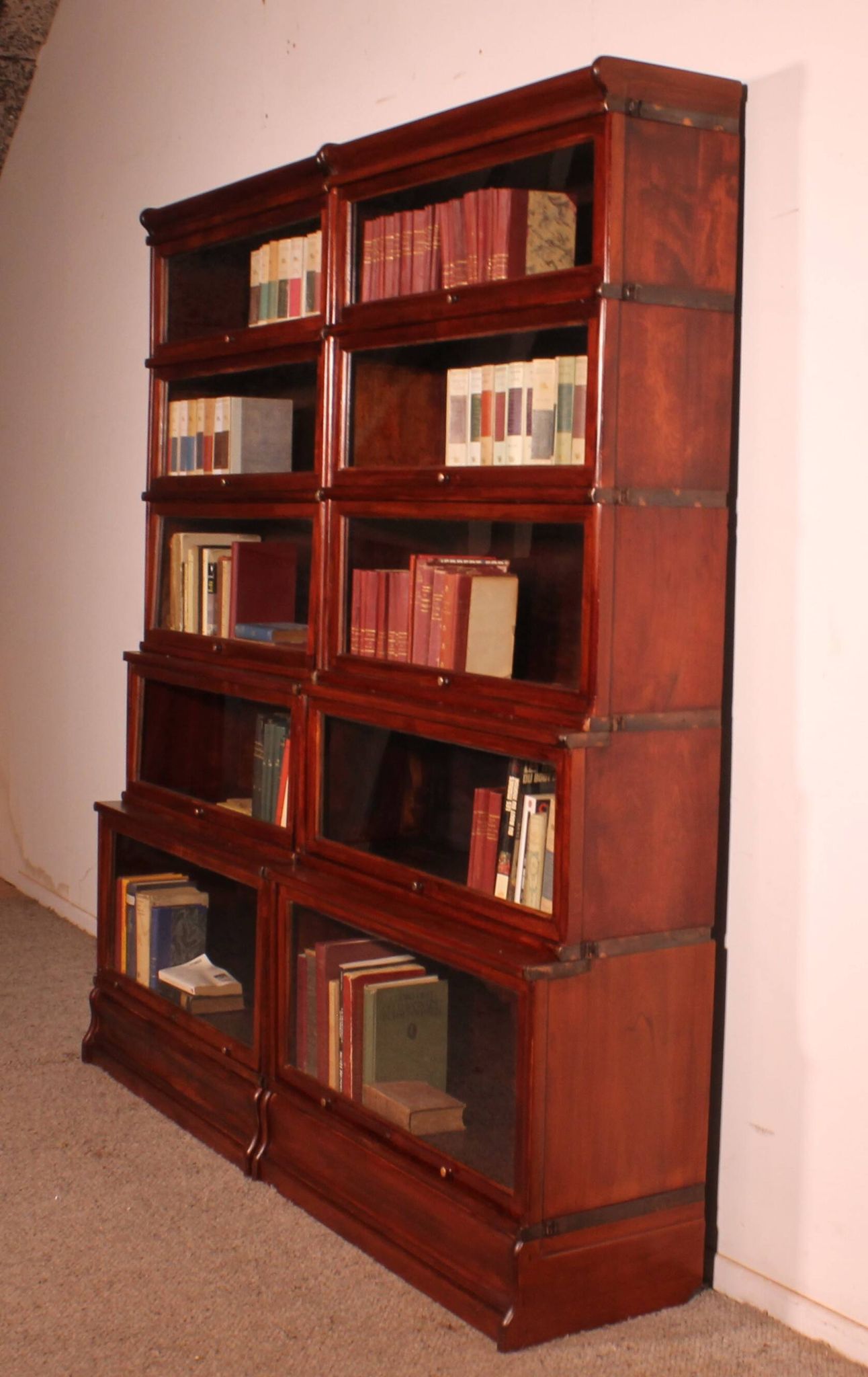 pair of Globe Wernicke London 'waterfall' bookcases in mahogany circa