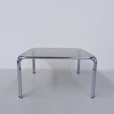 Coffee table with smoked glass top in chromed frame