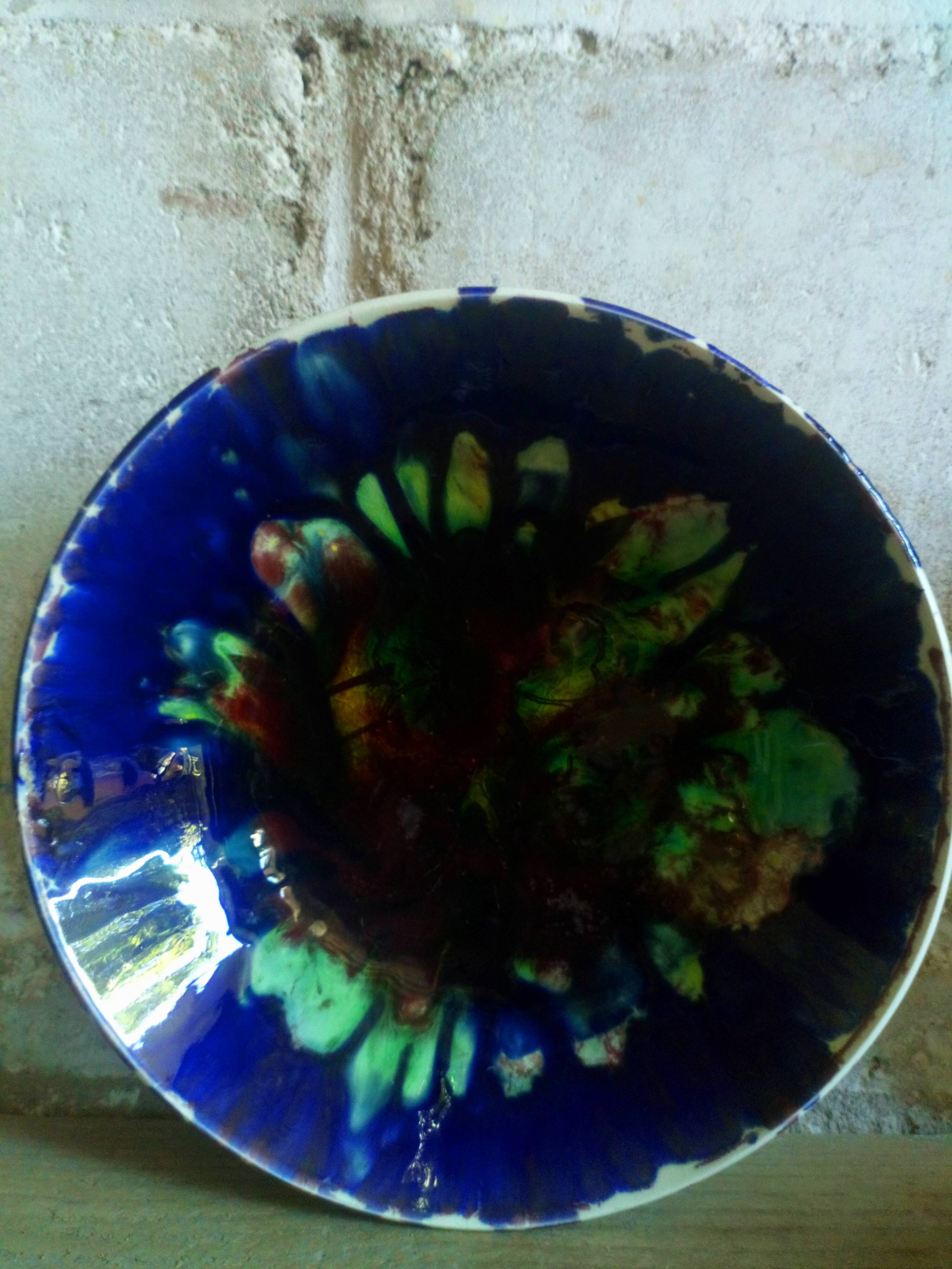 Seven plates of potter with multicolored enamels