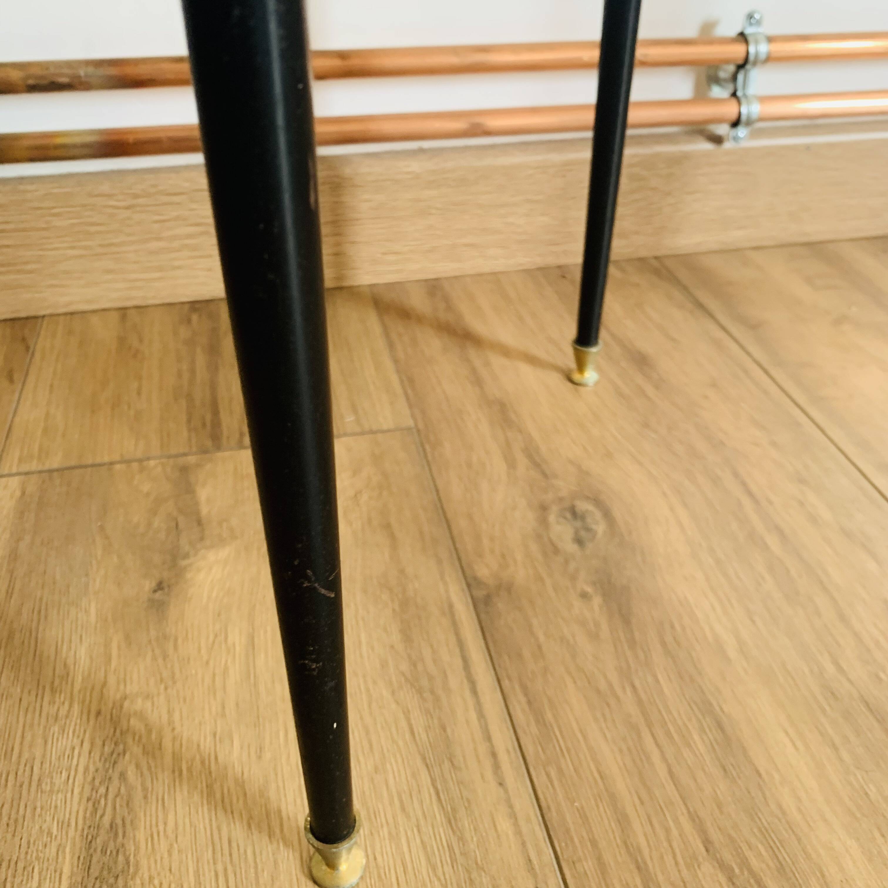 Coffee table from the 50s/60s, glass, brass, black metal.