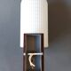 1960 wall light in gilded brass and rosewood.
