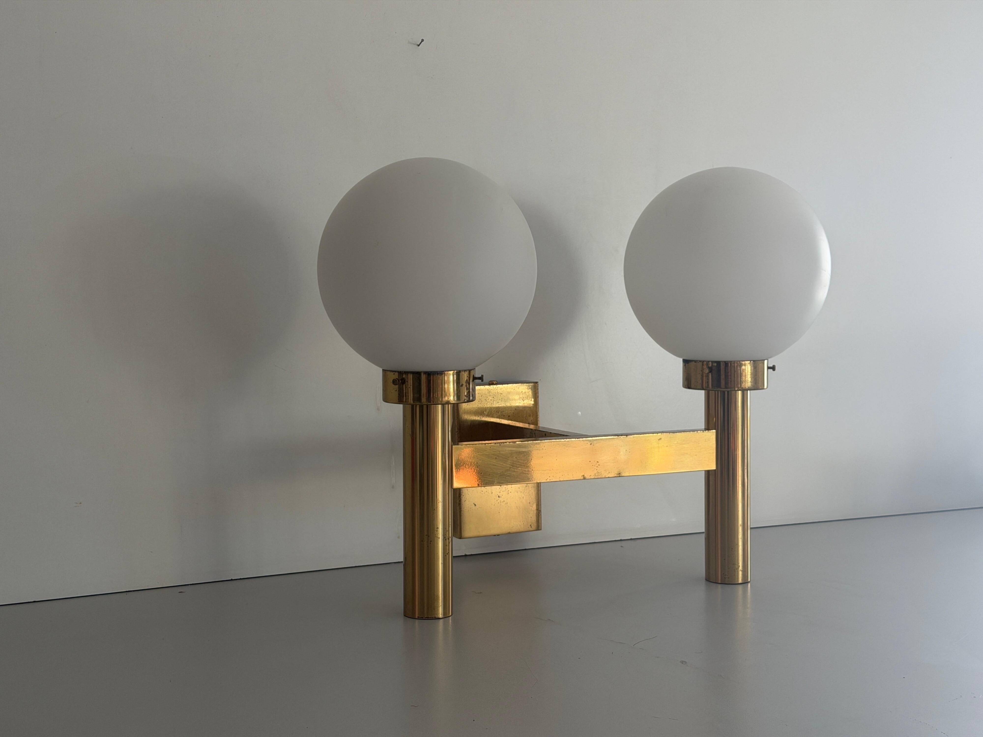Double opal glass and heavy brass, large minimalist cinema wall light, 1960s, Germany