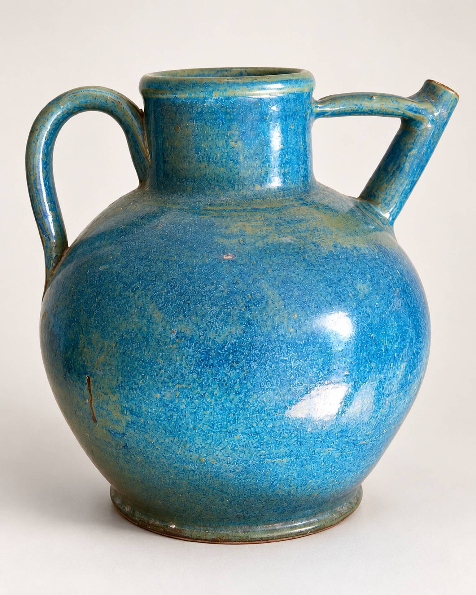Old oriole in speckled blue glazed stoneware, south-west.