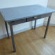 Metal kitchen table with gray speckled enameled top from the 1940s