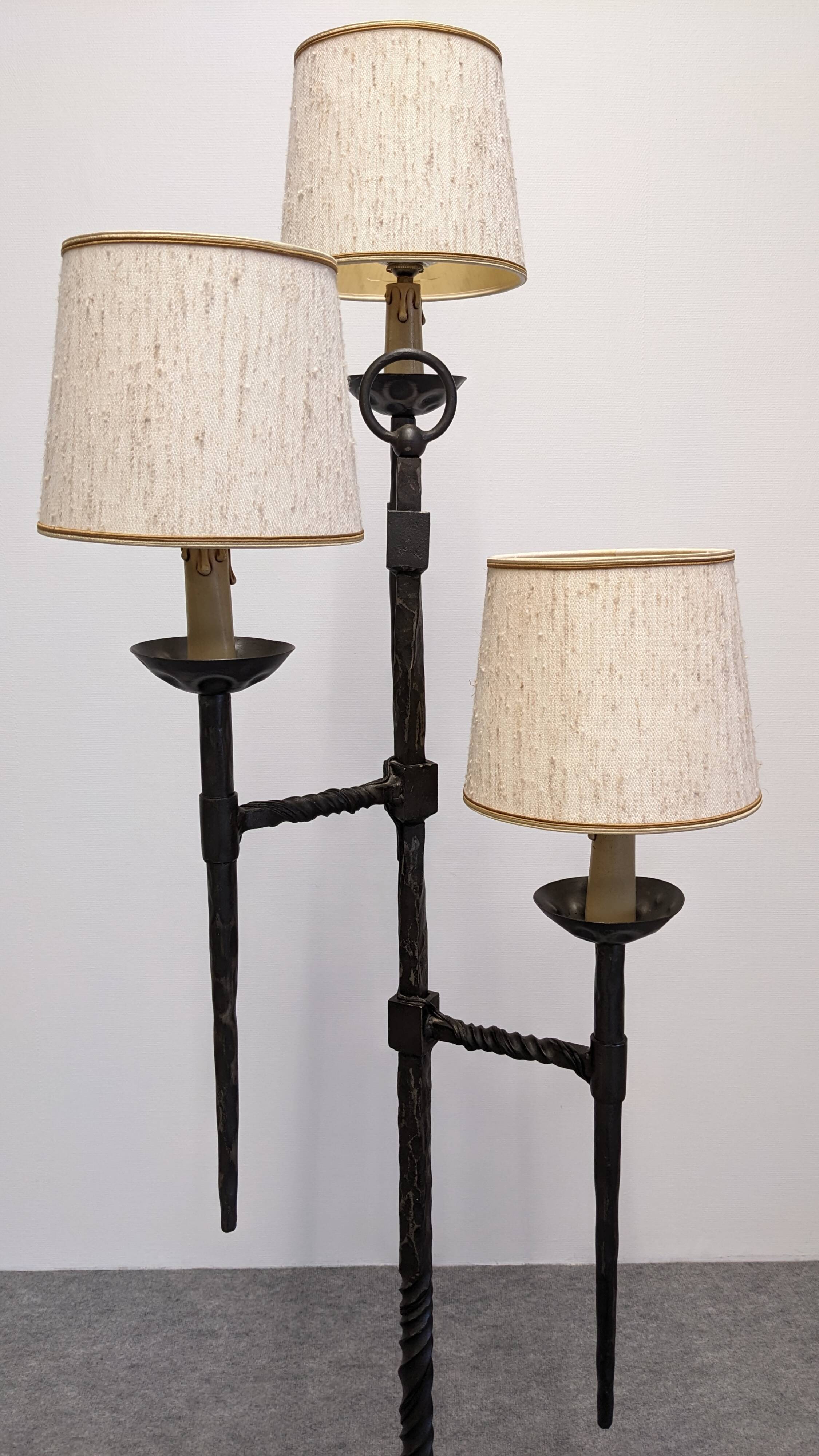 Brutalist tripod floor lamp with 3 lights in wrought iron, France circa 1950.