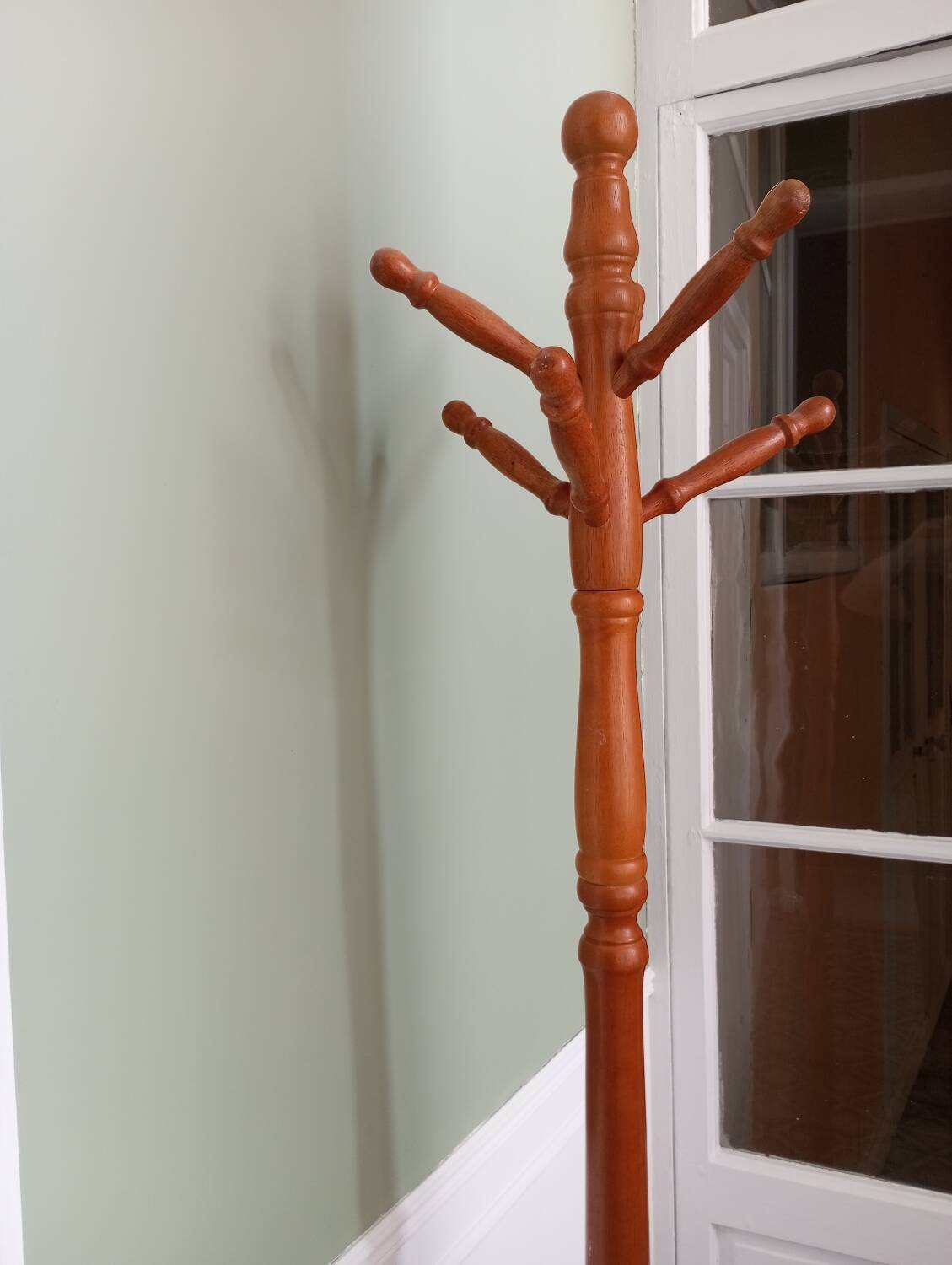 Wooden coat rack on stand