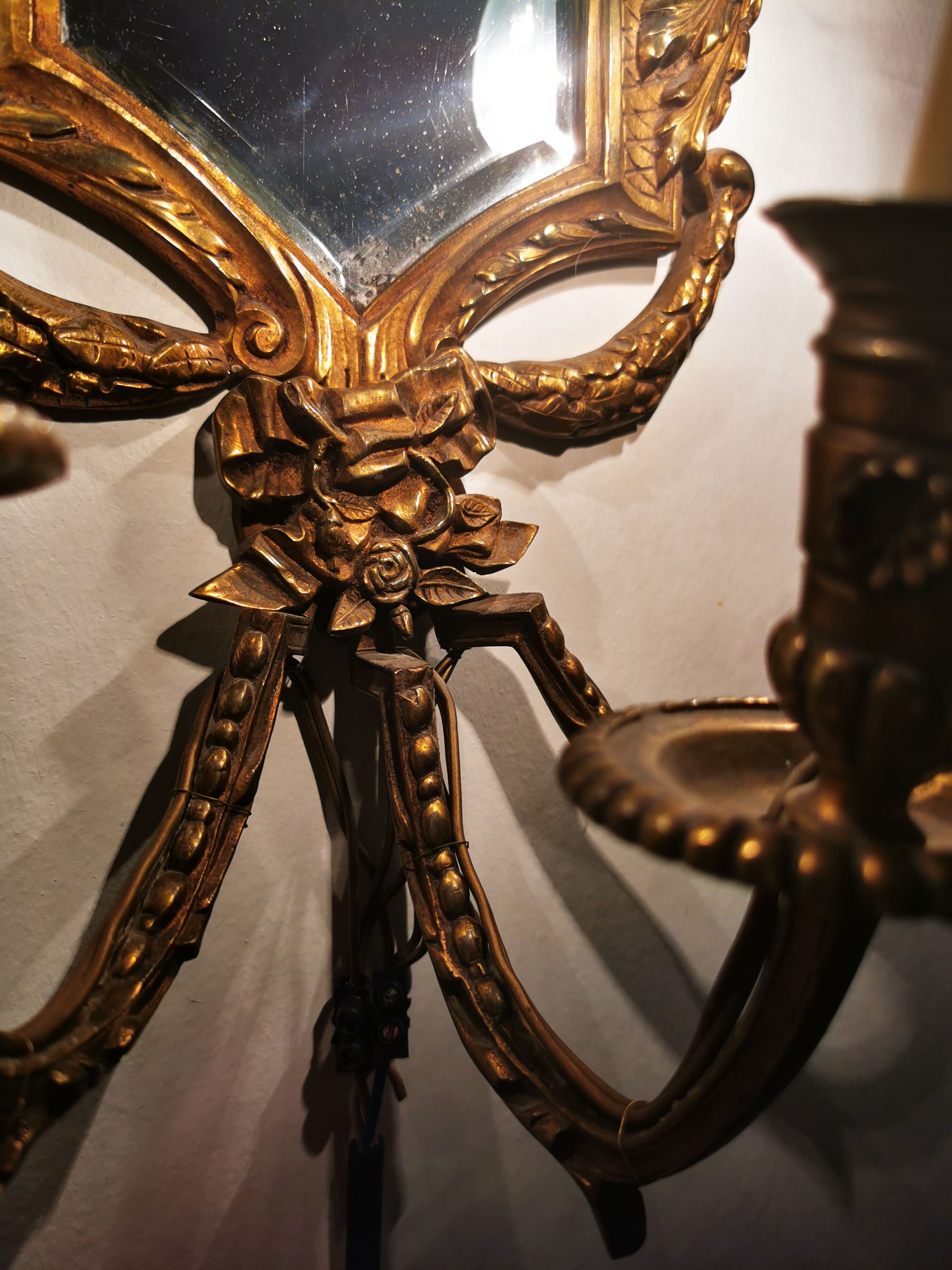 Pair of chissed and gilded bronze mirrors forming appliques