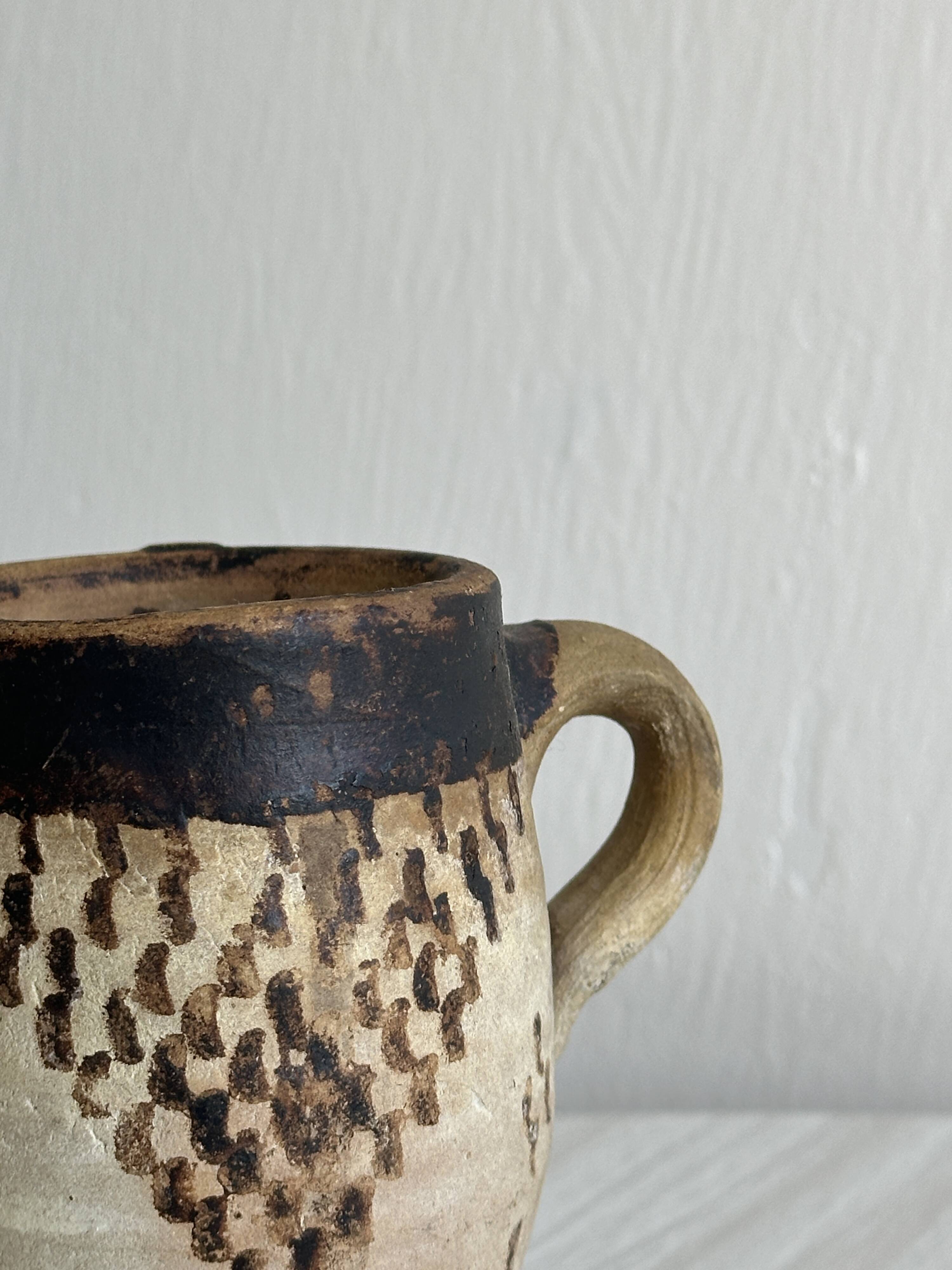 Small old terracotta cup