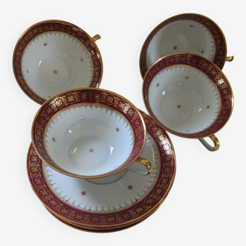 Gold and burgundy cups and saucers