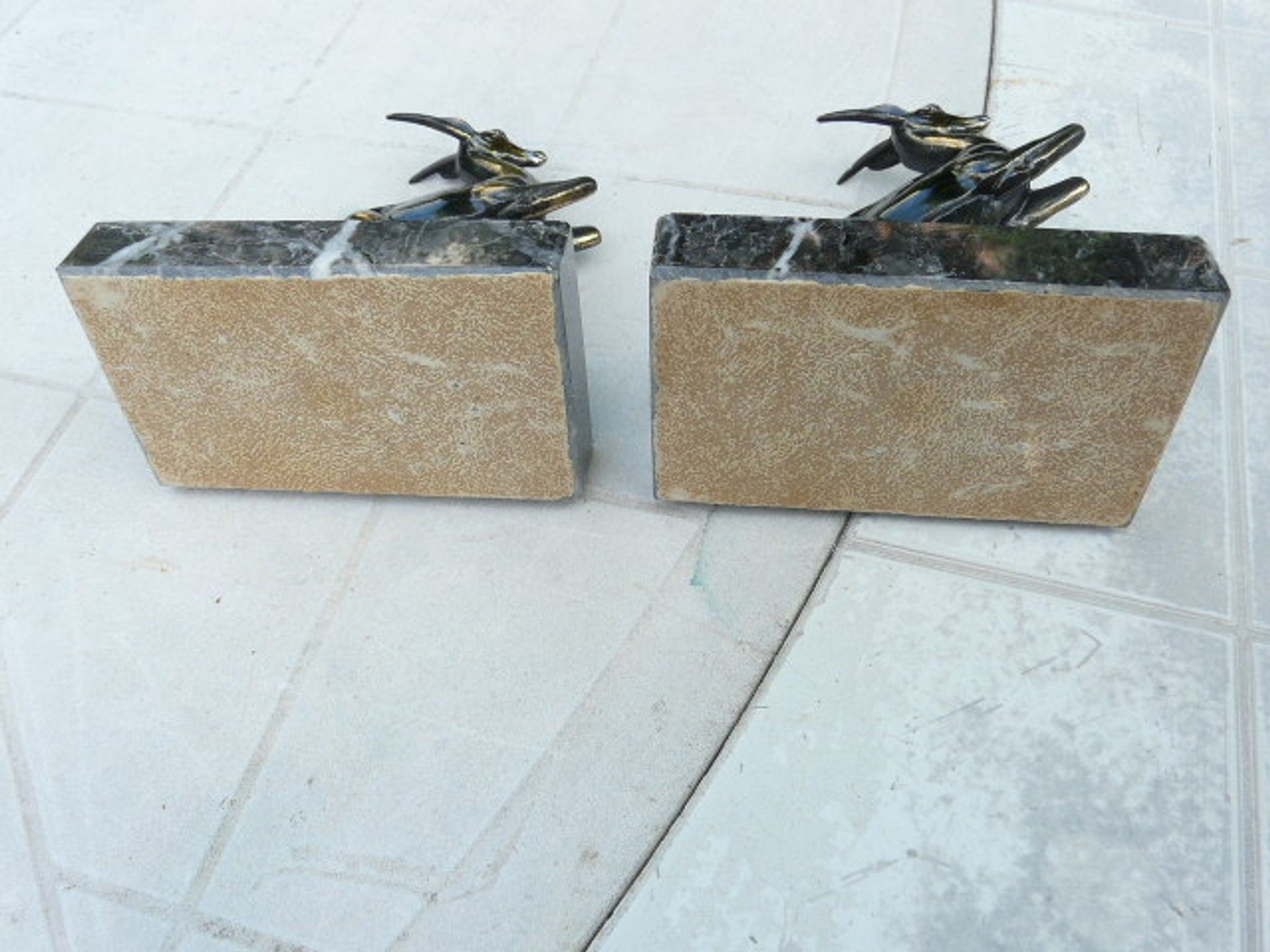 Pair of greenhouse book antelope in regulation on marble base