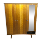 French wardrobe with tapered legs, 3 doors, 1 mirror (27*130), and 1 drawer.