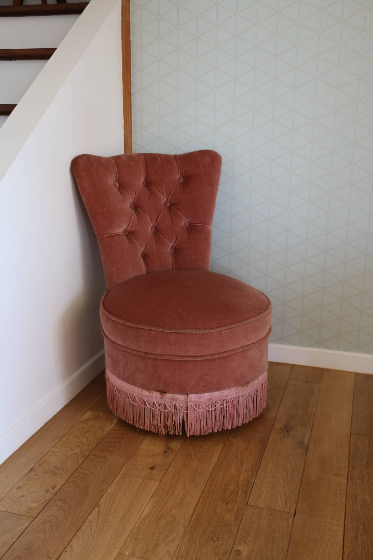 Powder pink fireside chair with fringes