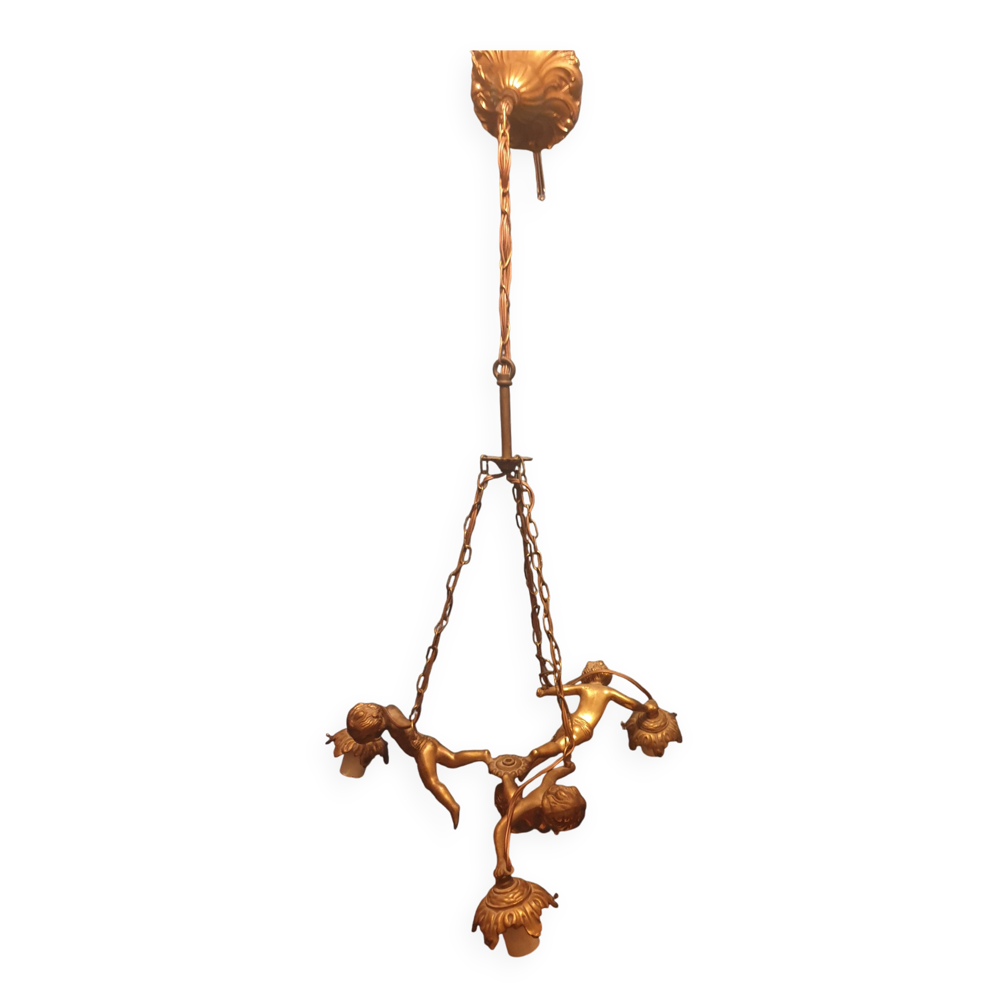Antique chandelier decorated with cherubs and putti angels taken from the attic